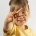 Child calmly painting a plaster craft kit at a peaceful table setup, enjoying screen-free mindful play